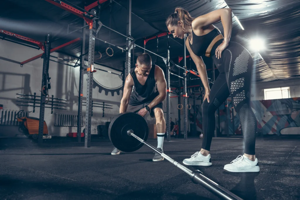 athletic man woman with dumbbells copy